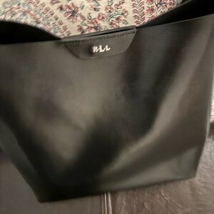 Ralph Lauren black handbag. Magnetic closure, hand held/shoulder strap option.